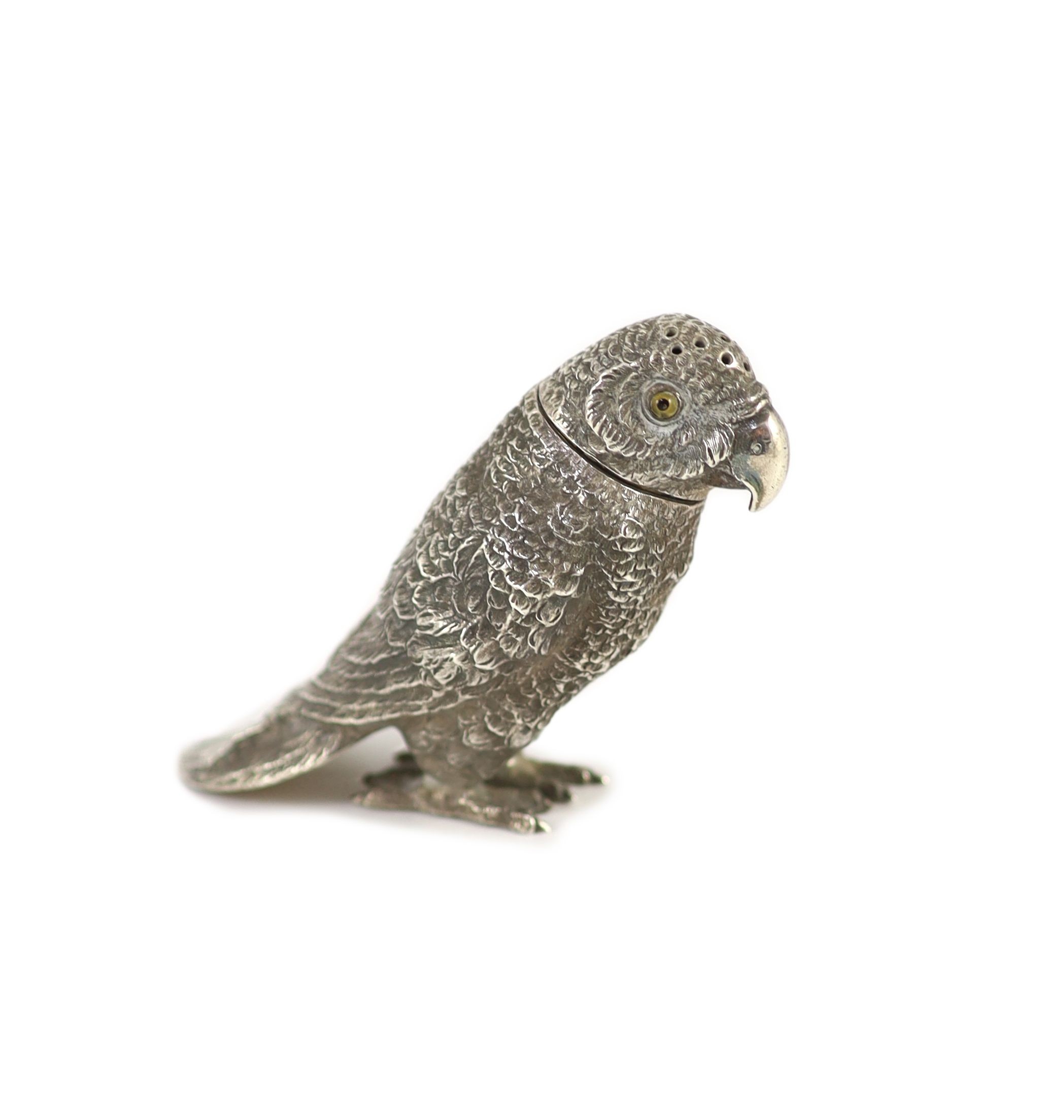 A late 19th century Hanau novelty silver pepperette, modelled as a parrot